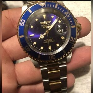 automatic Invicta gold and silver stainless steel quartz movement purple dial